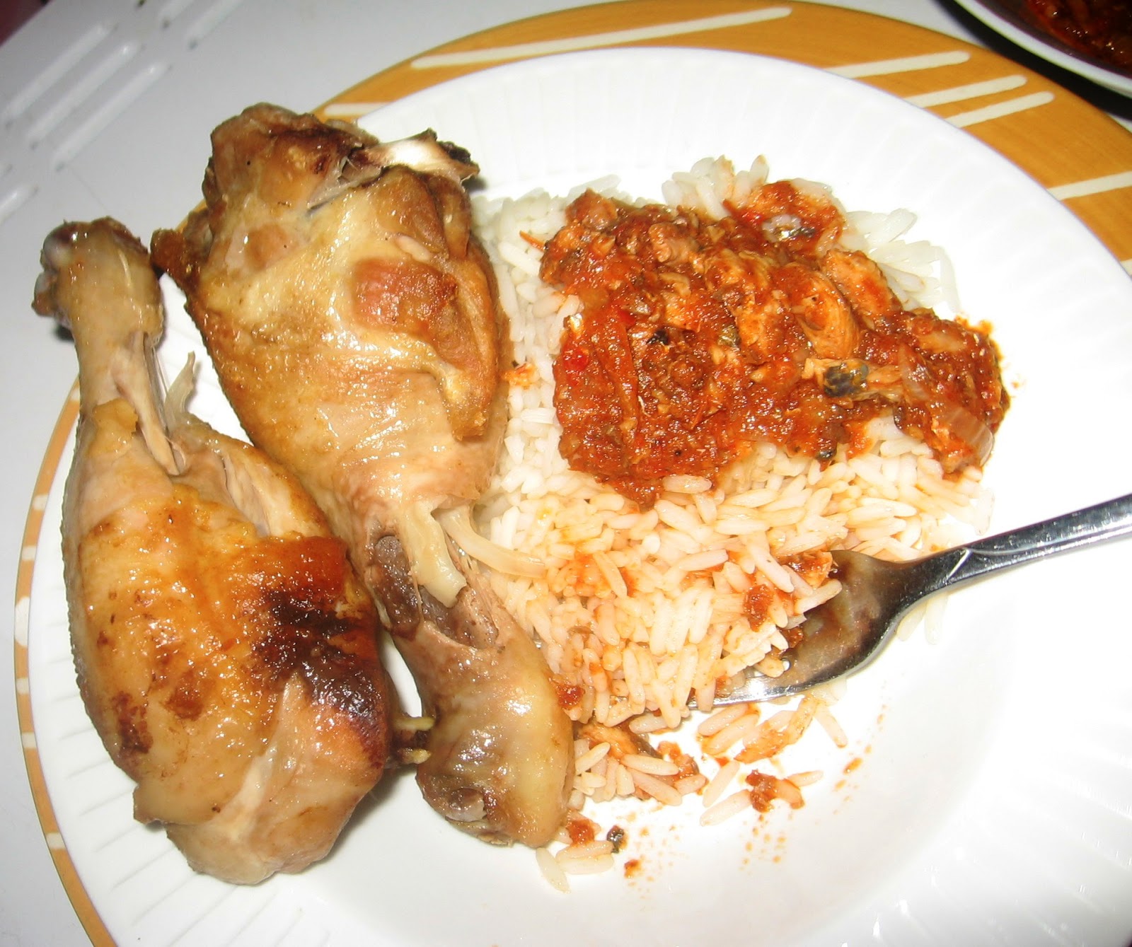 Rice And Fish Stew Served With Juicy Chicken Drumsticks