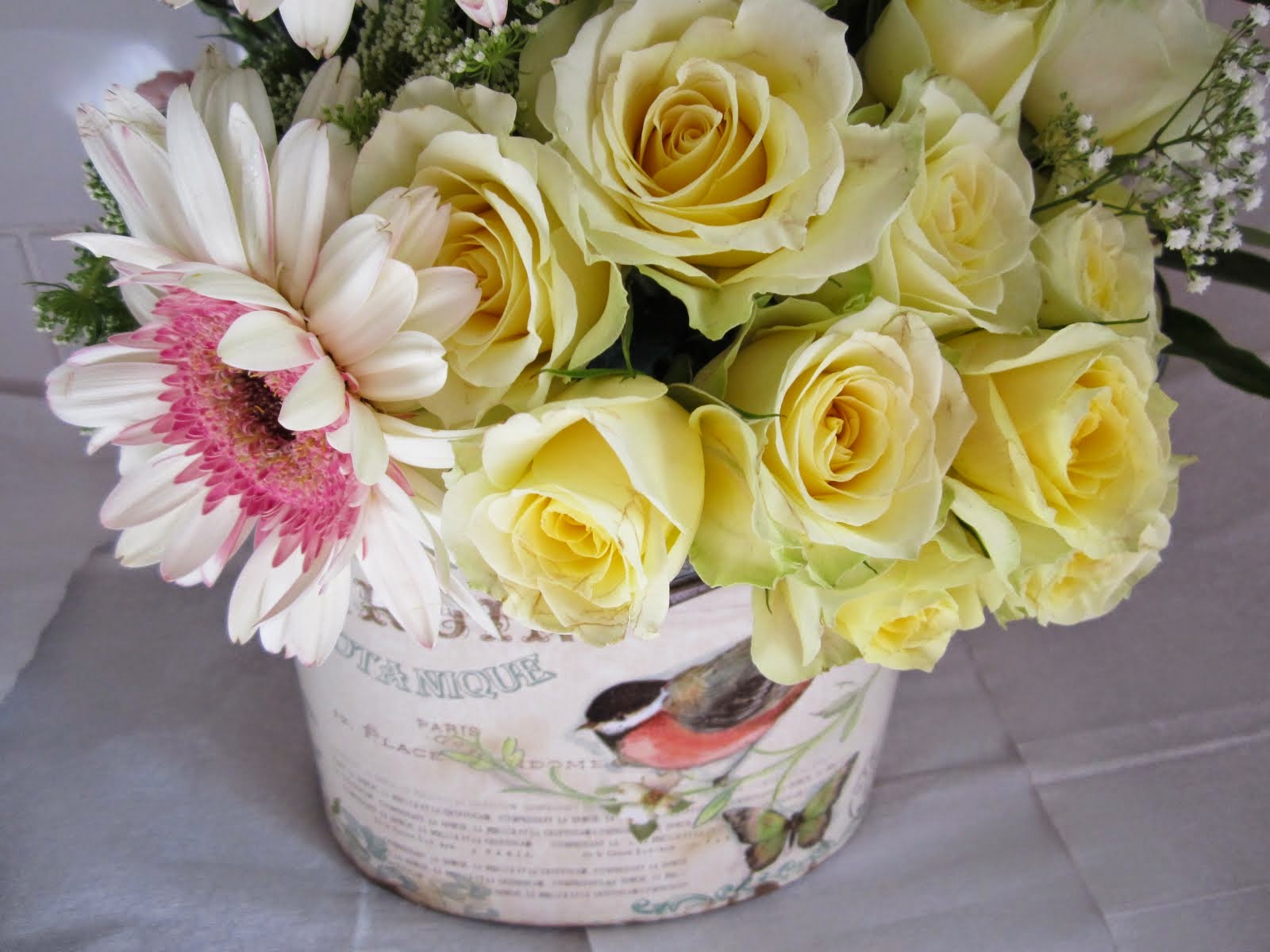 Flowers in a painted tin