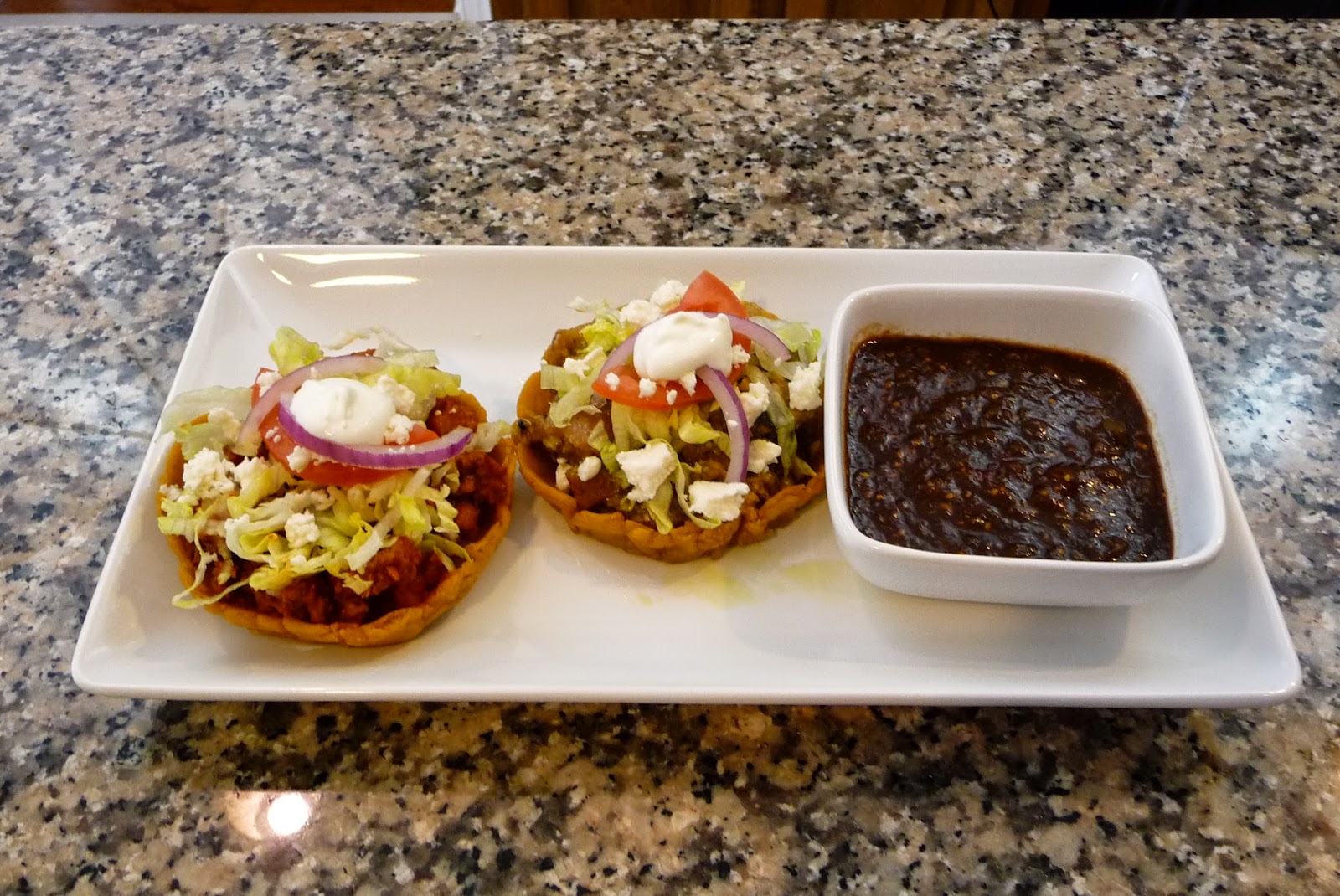 Mexican Sopes filled with Pork Rinds in Green Sauce and Meat and Potato