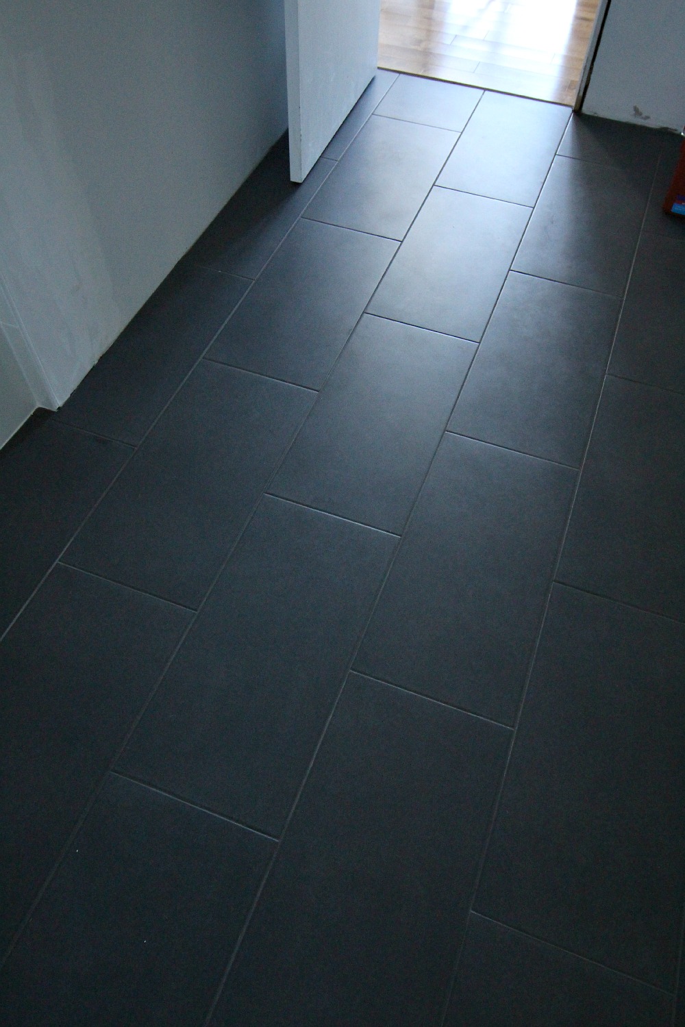 bathroom update the tile is done and i m livid dans le lakehouse