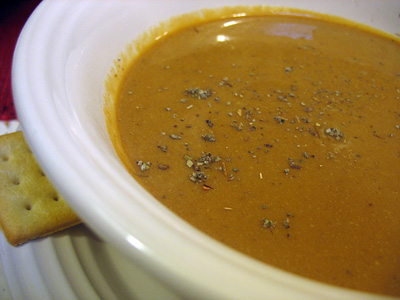 Pumpkin soup with sage sprinkled on top.