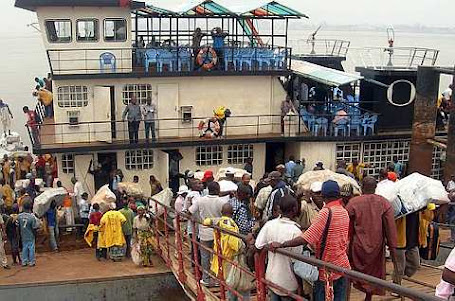 People work near a ferryboat