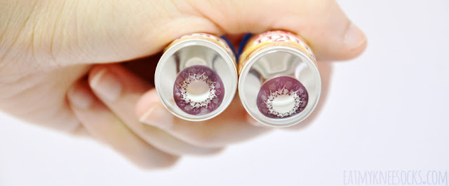 Geo Coloured Lenses Review: Geo Mimi Cafe Cappuccino Violet Close-up of the Geo Mimi Cafe Cappuccino Violet/Red circle lenses from Geo Coloured Lenses, as viewed in their glass vials.