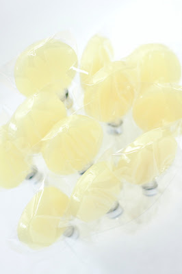 cream or off-white lollipops in Pina Colada flavor