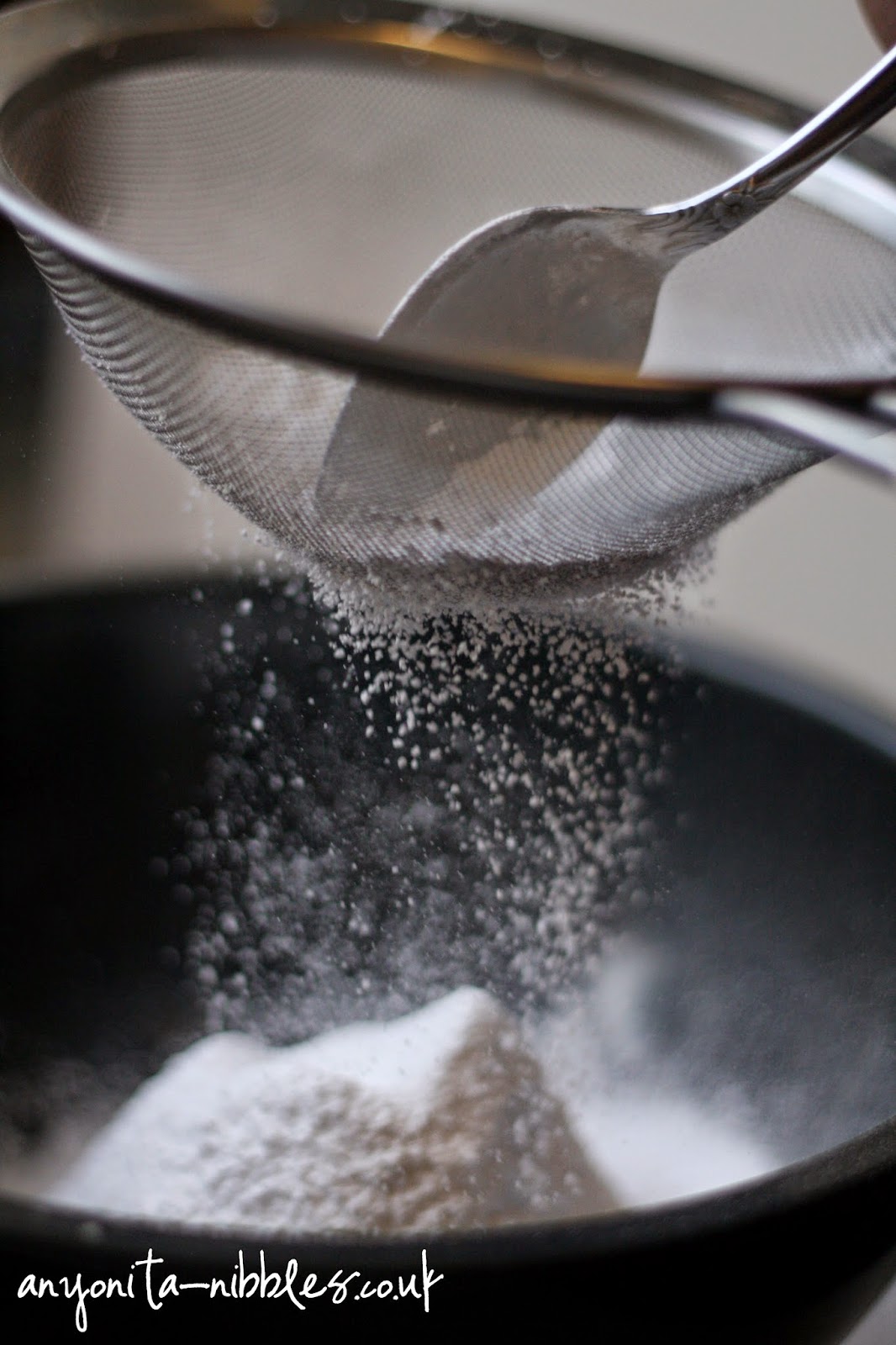 Sifting icing sugar to make macarons  from Anyonita-nibbles.co.uk