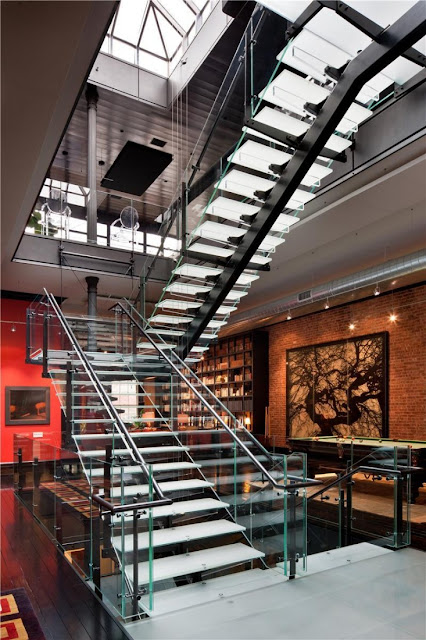 Photo of large glass staircase in the Tribeca triplex