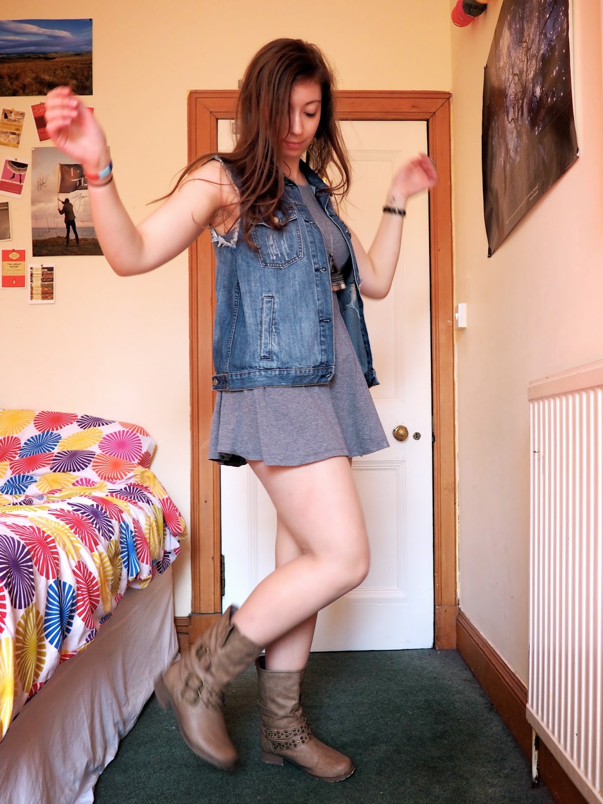 Distressed Denim outfit | ripped denim vest, short grey dress, brown studded boots