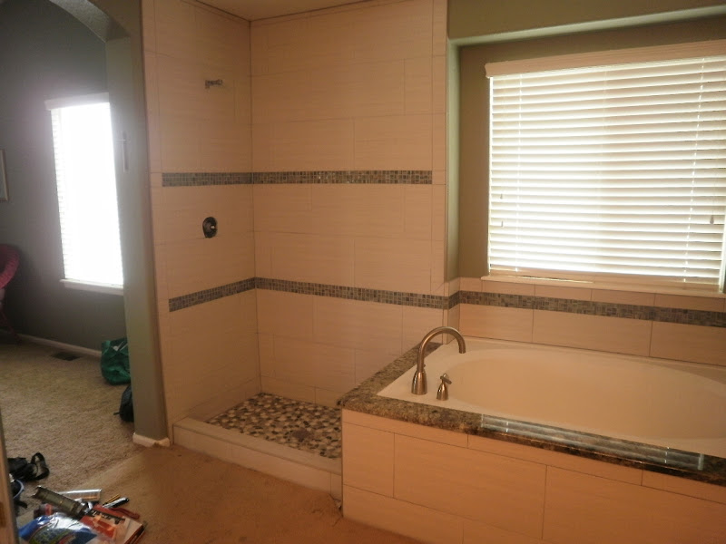  us tile installers in business remodeling their carpeted bathrooms title=