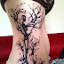 Skeleton tree tattoo on side body 