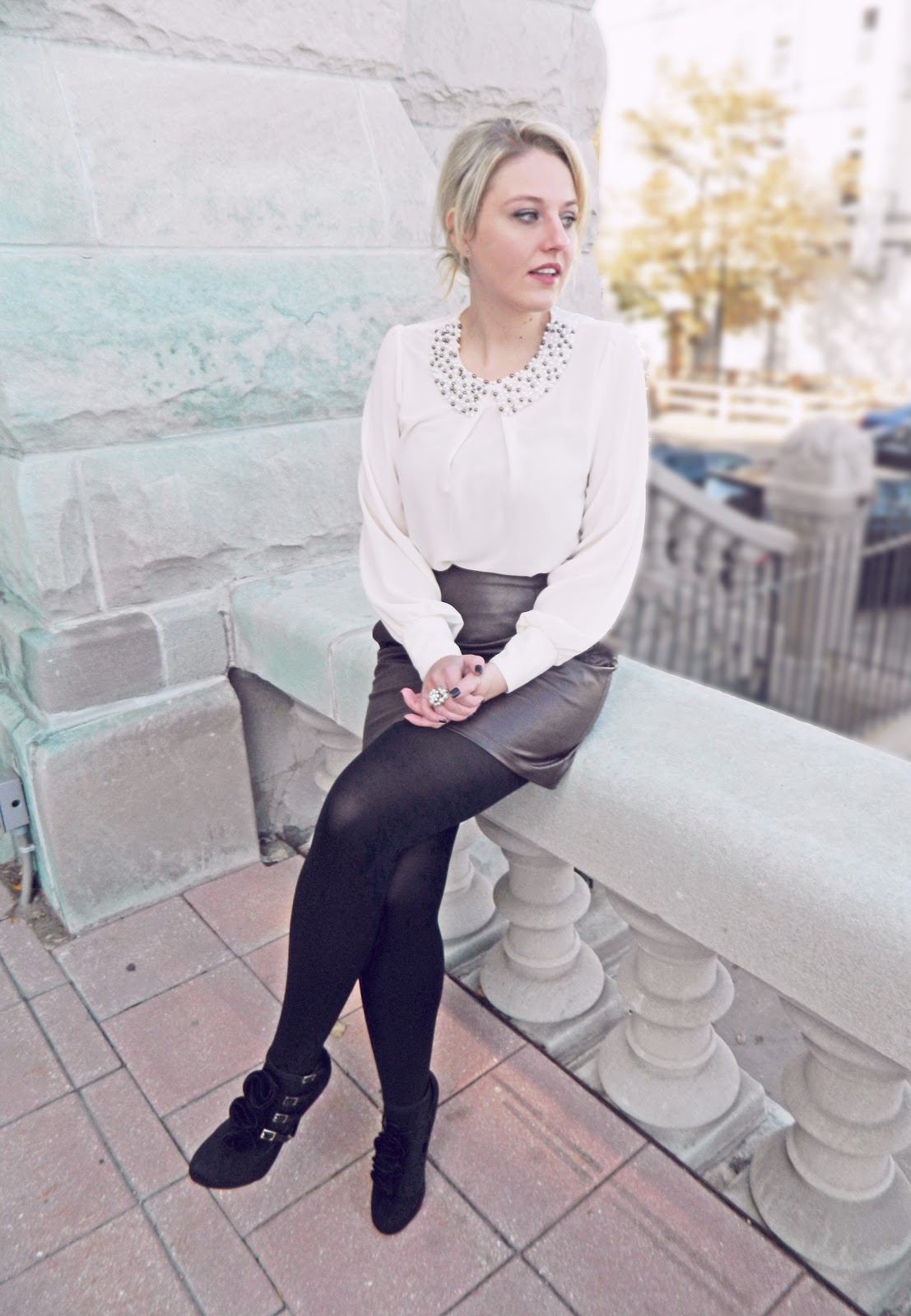 pearled blouse and leather skirt
