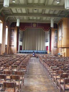 merchant taylors school great hall with stage, organ and assembly seating