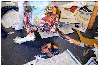 a sculpture of a dog squatting