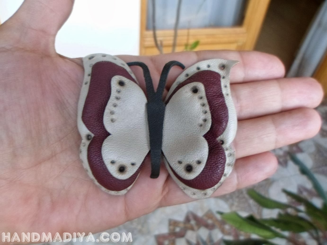-  . Butterfly barrette leather