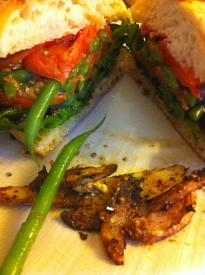 Ciabatta Green Bean Sando with a side of crispy fingerlings Sliced on plate Ciabatta Green Bean Sando with a side of crispy fingerlings