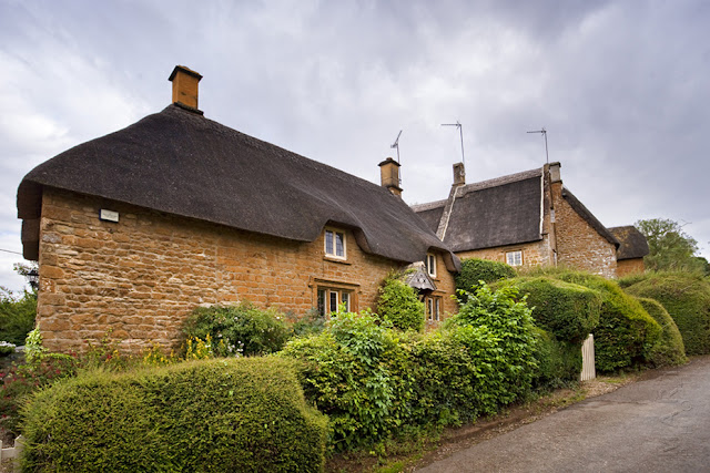 Thatched cottages in the Cotswold village of Great Tew by Martyn Ferry Photography