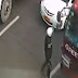 Traffic Enforcer Holds on to the Wiper of an Escaping Truck