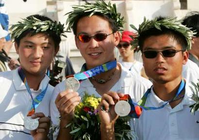 بالصور: بطلات الجمباز الإيقاعي Taiwan%27s+silver+medallist+archers