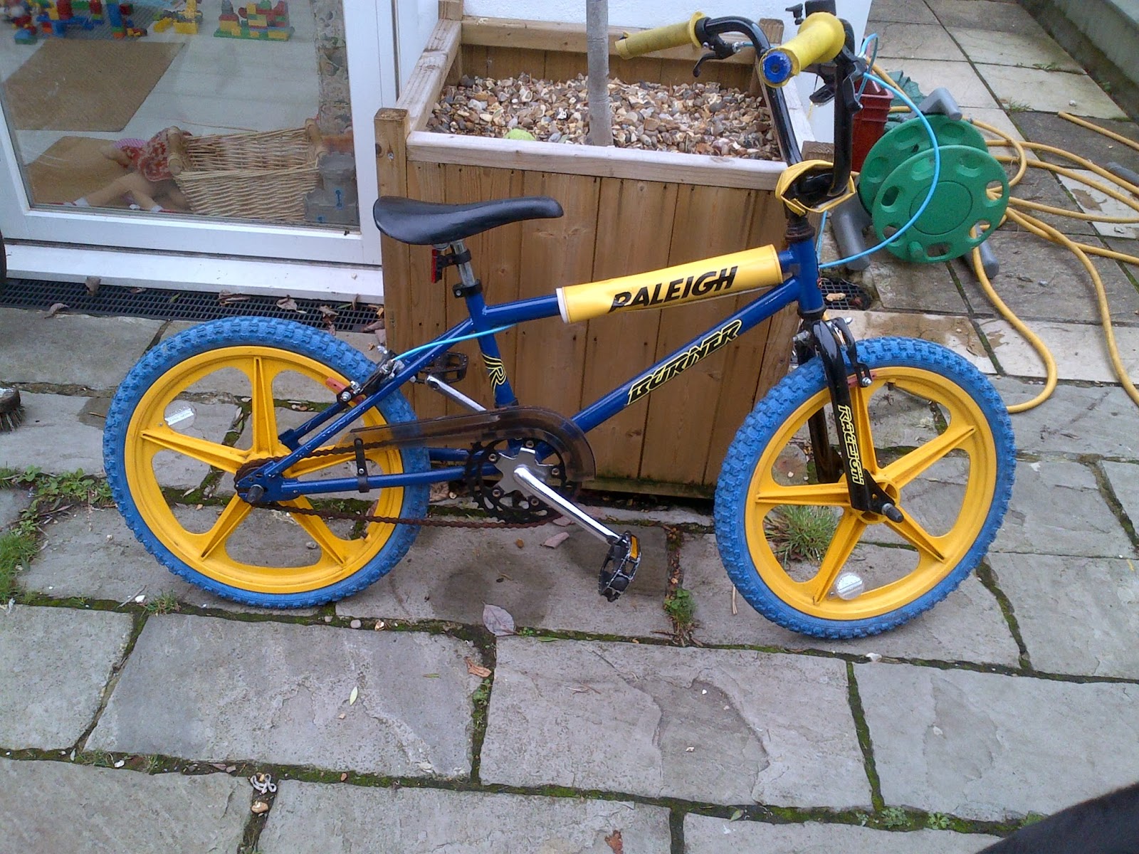 blue and yellow raleigh bmx
