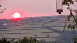 The Flaming June sun slowly sets over Rhos HIll