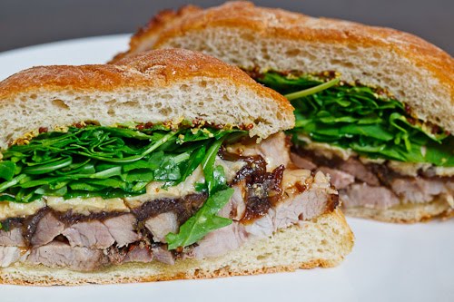 Porchetta Sandwich with Balsamic Caramelized Onions, Asiago Cheese and Arugula