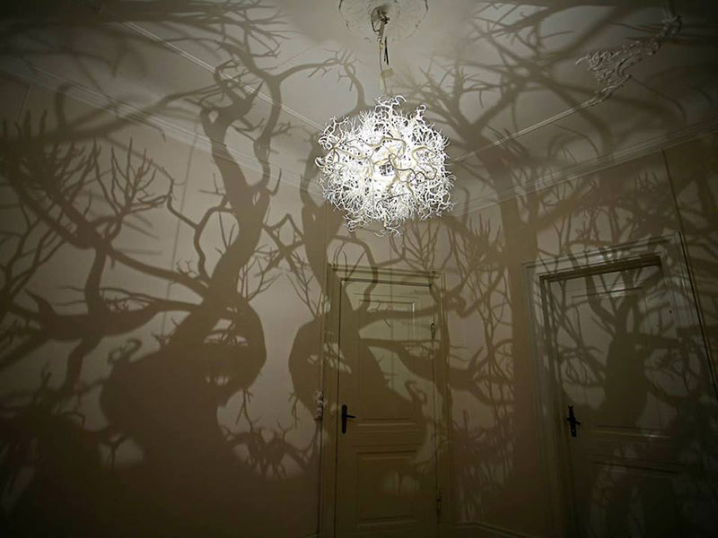 Turn Your Room Into A Forest Scene With This Chandelier A Collection Of Chandeliers Entitled Forms In Nature By Denmark Based Design Group Hilden Diaz That Casts Shadows Trees On The Surrounding Walls