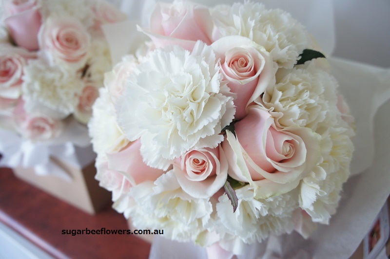 Bridesmaids bouquet with pale peach pink rose and white carnation