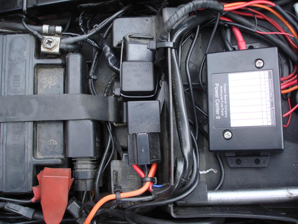 ... Aux fuse box. The harness wire that has the diode is spliced in to the  head light flasher circuit.