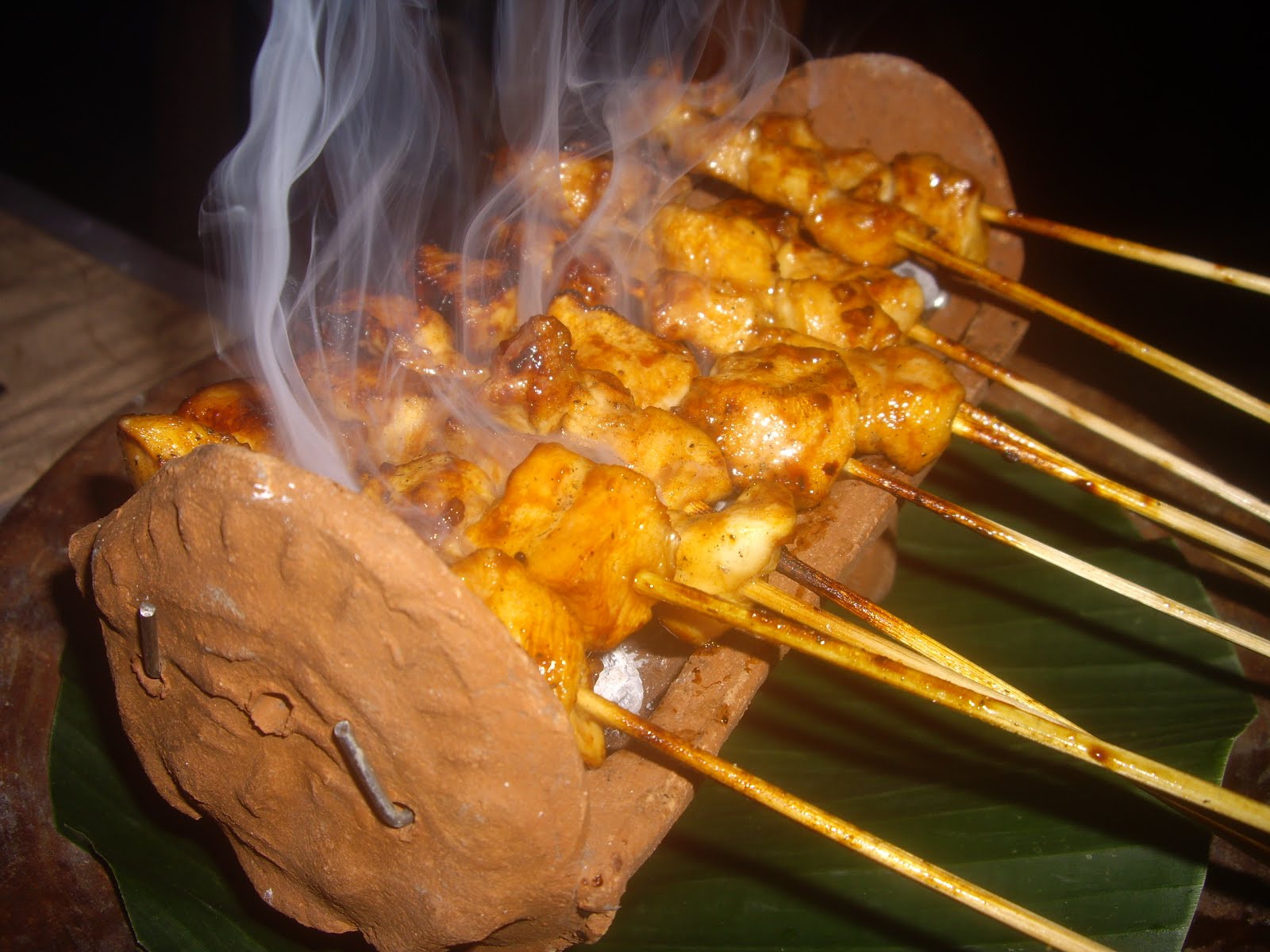 SATE STICKS GRILLED OVER A FIRE OR BRAZIER ARE A FAVORITE BALINESE CEREMONIAL FOOD