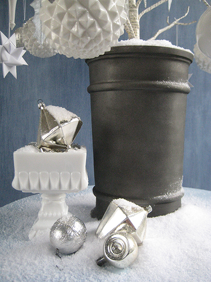 STATELY CONTAINERS Above The tree is placed in a gunmetal gray aluminum 