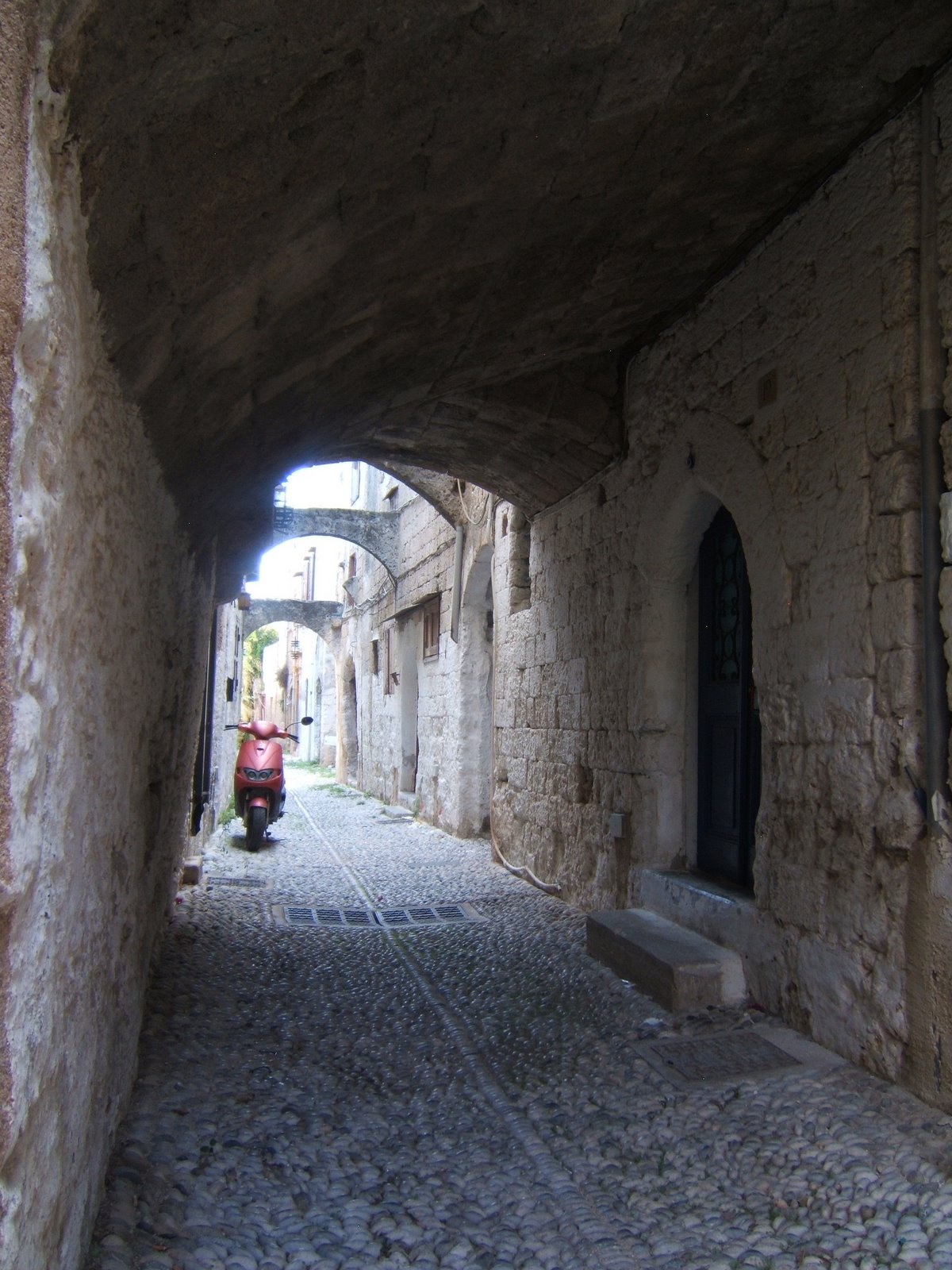Moped & Cobblestones. Old Town, Rhodes, Greece © 2008 Tina M Welter Nice parking space for your moped, Old Town, Rhodes, Greece © 2008 Tina M Welter