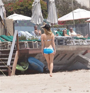 Avril Lavigne in wet bikini top and blue shorts having fun5