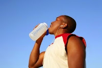 athlete drinking a drink