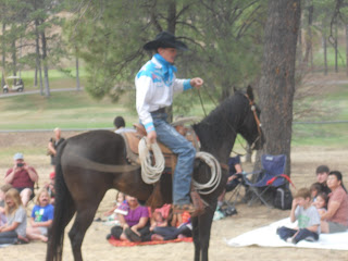 Summer Reading Trick Roper Cowboy in saddle with lasso