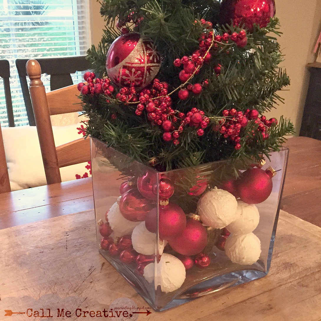 i love to pile ornaments of all sizes into glass vases or apothecary jars here ive added them to a large square vase alongside faux snowballs made with - How To Decorate Glass Vases For Christmas i love to pile ornaments of all sizes into glass vases or apothecary jars here ive added them to a large square vase alongside faux snowballs made with - How To Decorate Glass Vases For Christmas