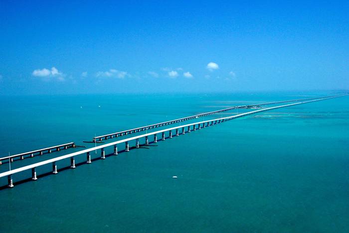 The Seven Mile Bridge is a famous bridge in the Florida Keys, in Monroe County, Florida, United States. It connects Knight's Key (part of the city of Marathon, Florida) in the Middle Keys to Little Duck Key in the Lower Keys. Among the longest bridges in existence when it was built, it is one of the many bridges on US 1 in the Keys, where the road is called the Overseas Highway.