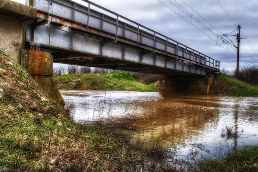 The Railway Bridge And a Small River Flowing Under The Railway Bridge And a Small River Flowing Under