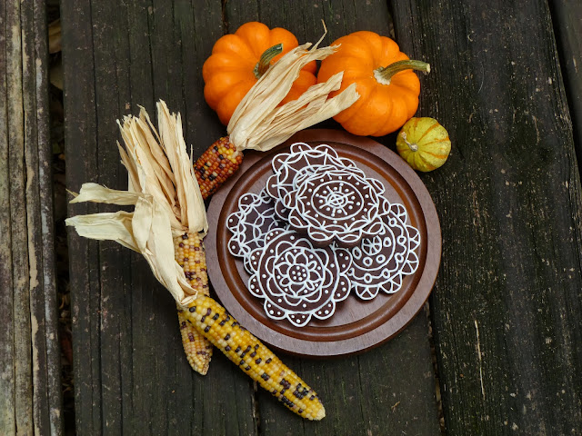 uniquely beautiful decorated dark-chocolate tea biscuits with autumnal corn and pumpkins