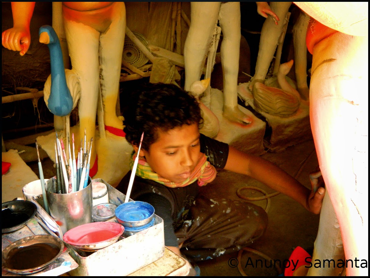 Durga Puja 2014 - Artisans busy in Painting of Idols