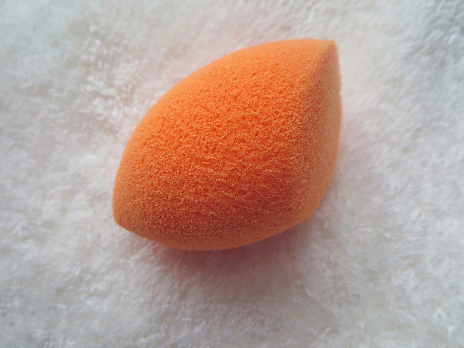 a picture of a clean and wet Complexion Miracle Sponge by Real Techniques