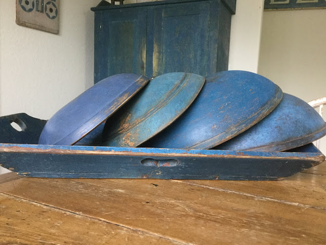 Photo from Polly Minick of her wood bowls I painted blue (the 3 to the right).