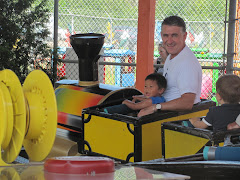 Alexandre and Dad going on a roller coaster