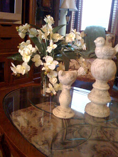 /></a></p> <p>When I got back home she added a couple more accessories (she has the bug too) and beefed it up a bit, but I stil  think it needs more color and deminsion so I am going to look for an intersting box to put on the table. The table is glass and that is the area rug under neath. Any advice would be much appreciated. Thanks in advance.</p> <p class=