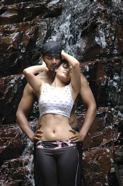 Indian actress Sneha Ullals wet pants get sticked to her body and expose hot thighs and sexy back