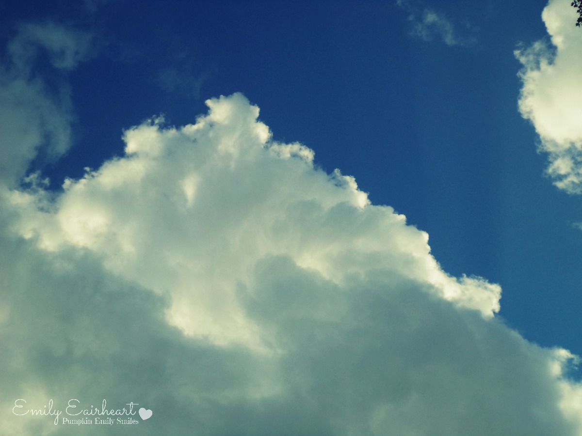 Clouds that look like a mountain and a face.