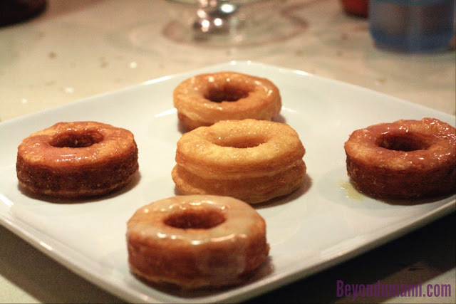 Five Cronuts laid out.At center: NQN's cronut, Left,Bottom,Right: DWJ Cronut, Top:Pilllsbury
