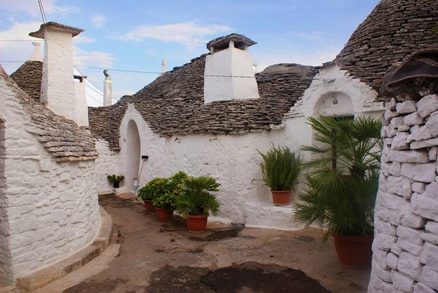 Alberobello a Unique Italian Village Alberobello, the city of drystone dwellings known as trulli , is an exceptional example of vernacular architecture. It is one of the best preserved and most homogeneous urban areas of this type in Europe. Its special features, and the fact that the buildings are still occupied, make it unique. It also represents a remarkable survival of prehistoric building techniques.