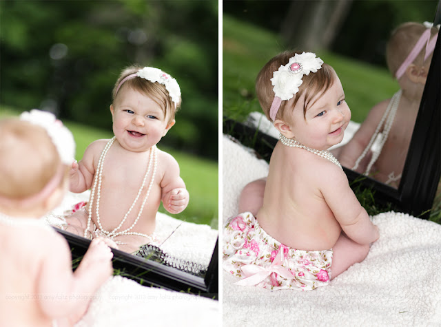 photos of a baby girl smiling in a mirror