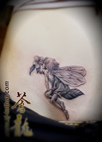 fairy tattoo on the belly