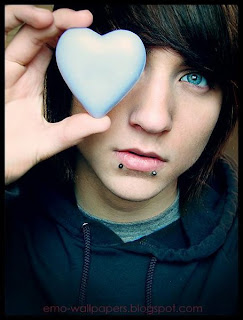 emo boy with his heart in hand - Images provided by http://photoforu.blogspot.com/