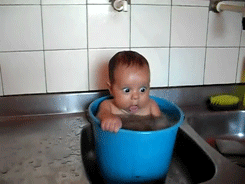 Baby sitting inside bucket Baby sitting inside bucket